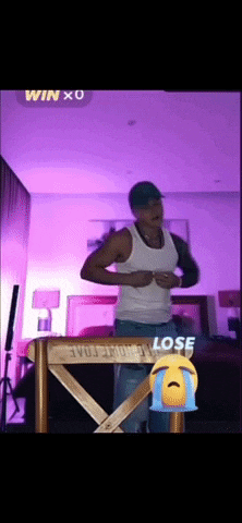 a man in a white tank top is dancing in a room with purple lights