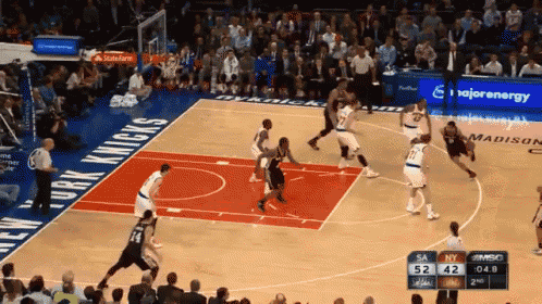 a basketball game is being played on a court sponsored by majorenergy