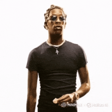 a man wearing sunglasses and a black t-shirt with the words minimax on the bottom right