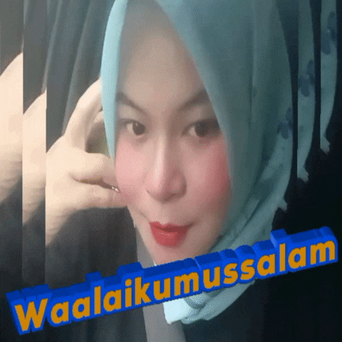 a woman wearing a blue hijab is talking on a cell phone with the words waalaikumussalam behind her