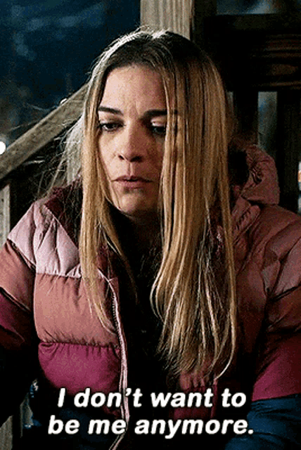 a woman in a pink jacket says " i don t want to be me anymore "