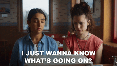 two women sitting in a diner with the words " i just wanna know what 's going on "