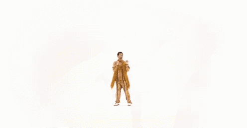 a man in a snakeskin shirt is dancing with his arms outstretched on a white background .