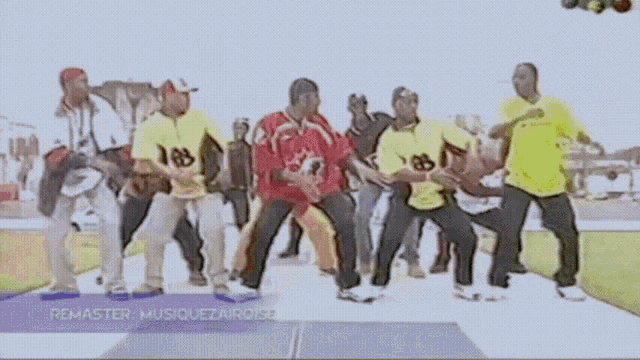 a group of people are dancing in front of a sign that says remaster musiquezairoise