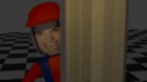 a man in a red hat is peeking out from behind a wall and smiling