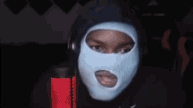 a person wearing a mask with the word who on the bottom