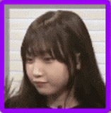a close up of a woman 's face in a purple frame