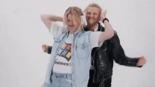 a man and a woman wearing headphones are dancing .