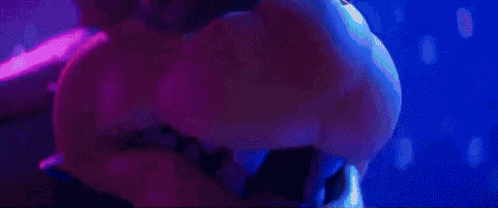 a girl in a blue and purple striped shirt stands in front of a monster