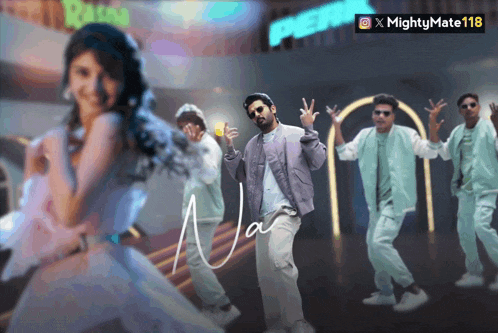 a group of people are dancing in front of a sign that says mighty mate 118