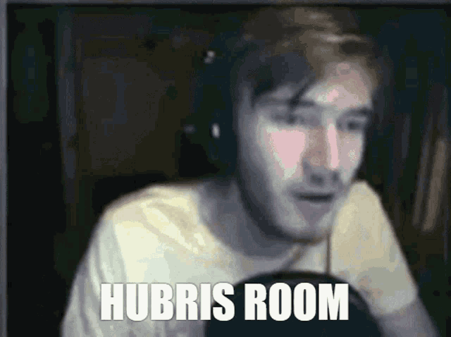 a blurry picture of a man with the words hubris room on the bottom