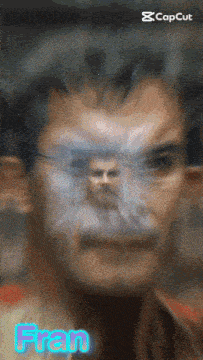 a blurry picture of a man with the name fran written on the bottom