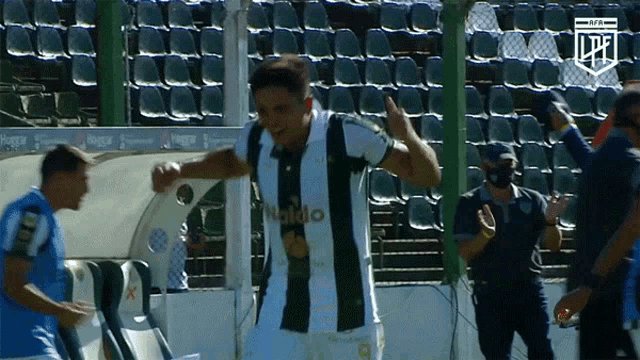 a man in a black and white striped shirt with the word haido on it
