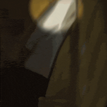 a shadow of a person is cast on a yellow object