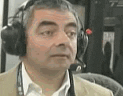 a man wearing headphones with a microphone around his neck .