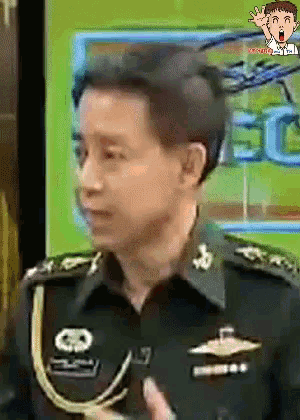 a man in a military uniform has a skull on his shoulder