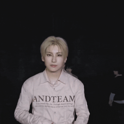 a man is wearing a shirt that says and team