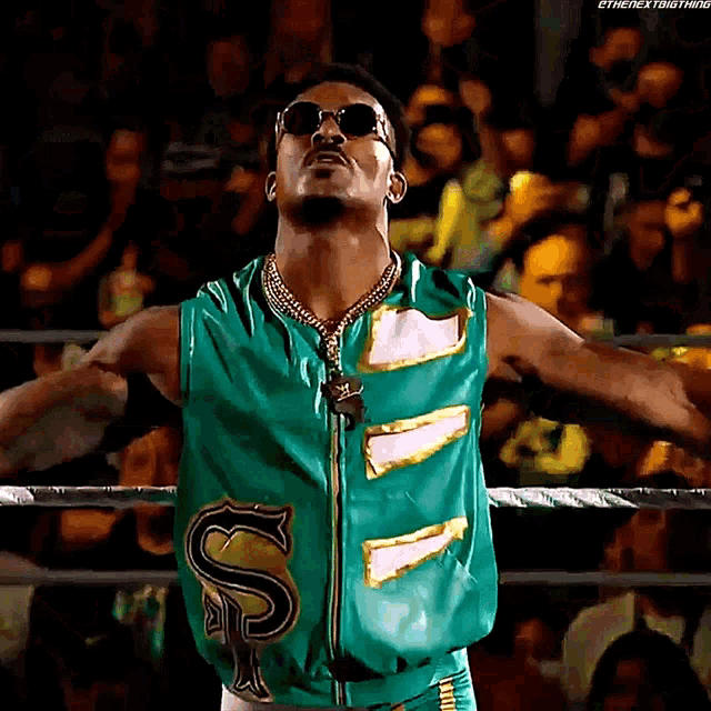 a wrestler with the letter s on his vest