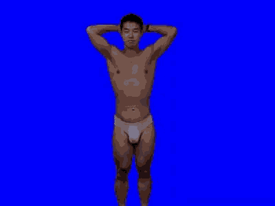 a shirtless man in white underwear is standing on a blue background .