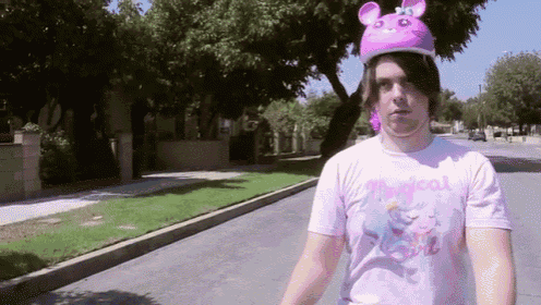 a person wearing a pink shirt that says magical on it