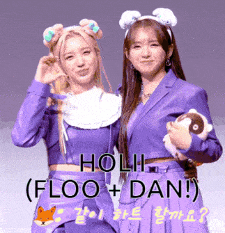 two girls in purple outfits are standing next to each other with the words holi floo dan written above them