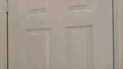 a pixelated image of a person wearing a red hat with the letter c on it