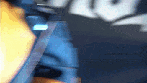 a blurred image of a person 's face with a blue and yellow background