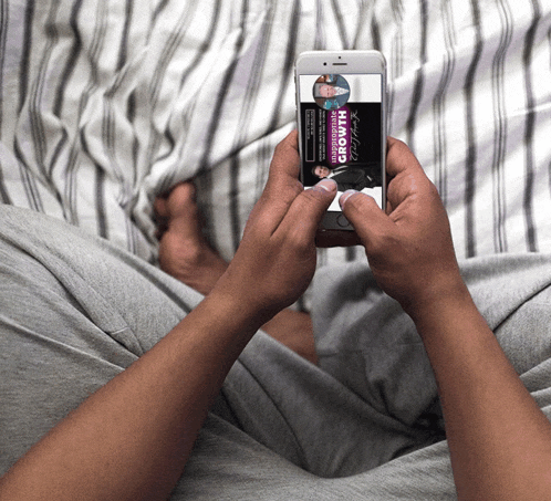a person is holding a cell phone that says growth
