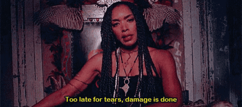 a woman is sitting on a throne with the words " too late for tears damage is done " on the bottom