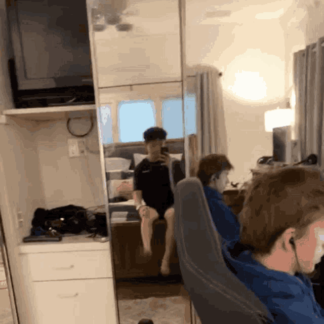 a man taking a selfie in front of a mirror