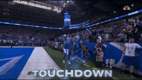 a football game is being played and the word touchdown is on the screen