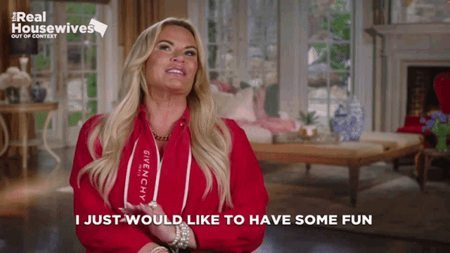 a woman wearing a red jacket that says givenchy on it says i just would like to have some fun