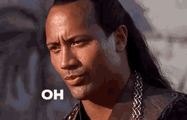 a man with long hair is making a funny face and the word oh is on his face .
