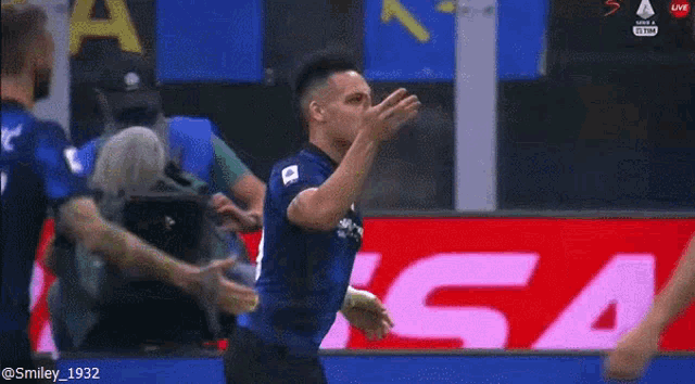 a soccer player with the number 10 on his jersey is celebrating