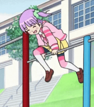 a girl with purple hair is sitting on a bar in front of a building