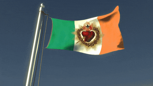 a green white and orange flag with a heart and cross on it