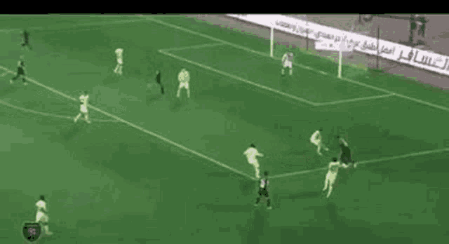a group of soccer players are playing on a soccer field .