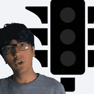 a man wearing glasses is standing in front of a black traffic light