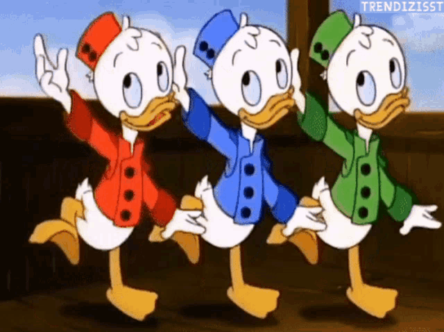 three cartoon ducks in different colors are dancing in a row