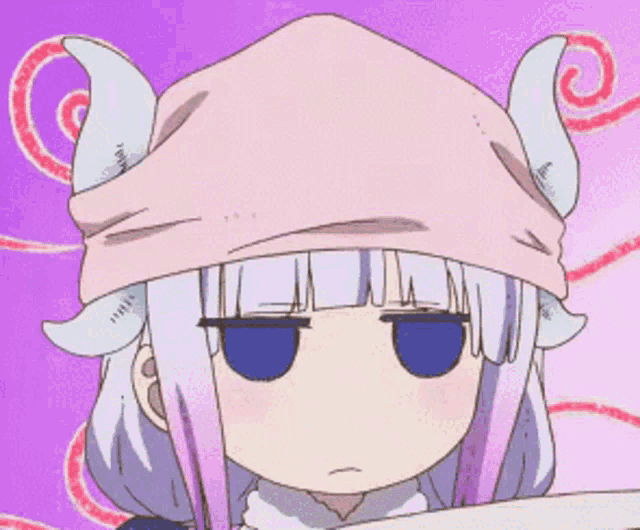 a girl with horns and a pink hat is making a funny face