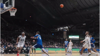 a basketball game is being played in a stadium with a player wearing number 23