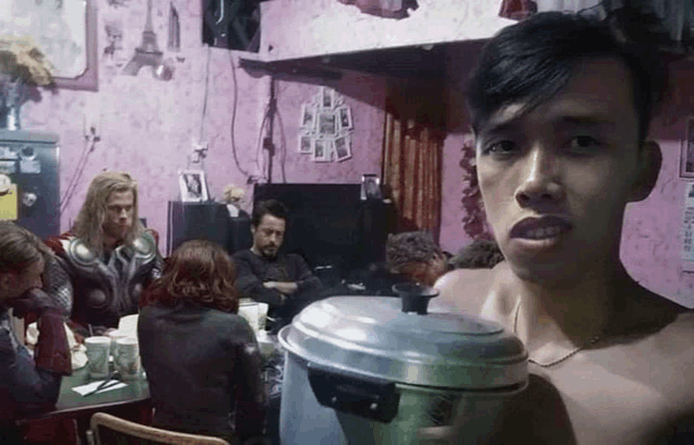 a group of people sitting around a table with a man holding a pot in front of them