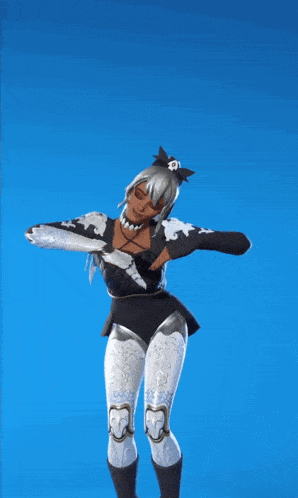 a woman in a black and white outfit is dancing