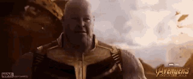 thanos from avengers infinity war is standing in front of a building .