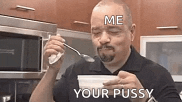 a man is eating yogurt with a spoon in a kitchen and saying `` me your pussy '' .