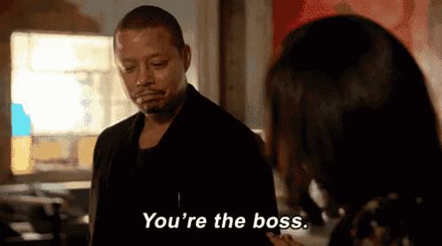 a man and a woman are standing next to each other and the man says you 're the boss .