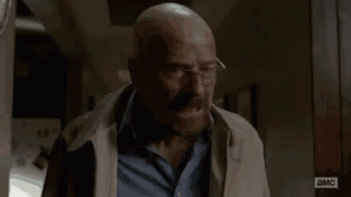a bald man with glasses is smoking a cigarette and saying `` we 're a family '' .