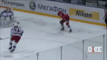 a hockey game is being played on a nikon sponsored rink