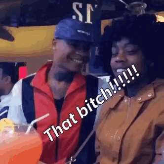 a man and a woman are sitting next to each other and one of them says that bitch