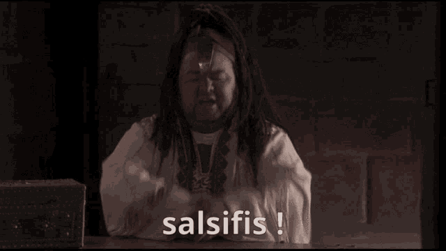 a woman covering her face with her hands and the words salsifiis written on the screen